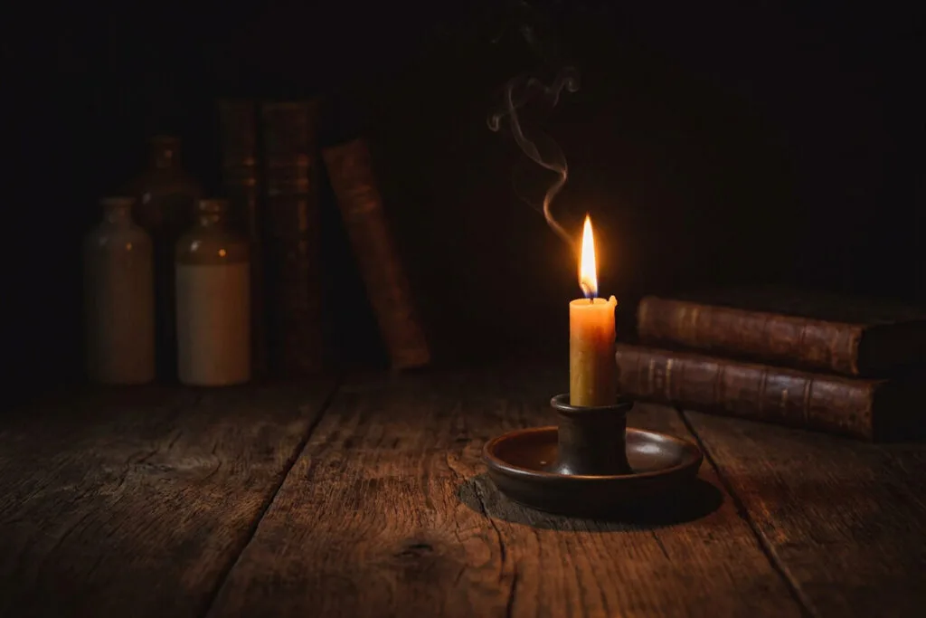A candle burning in the darkness